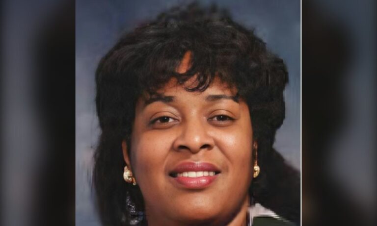 Portrait photograph of Wanda Mullen Walker, smiling, wearing a dark jacket.