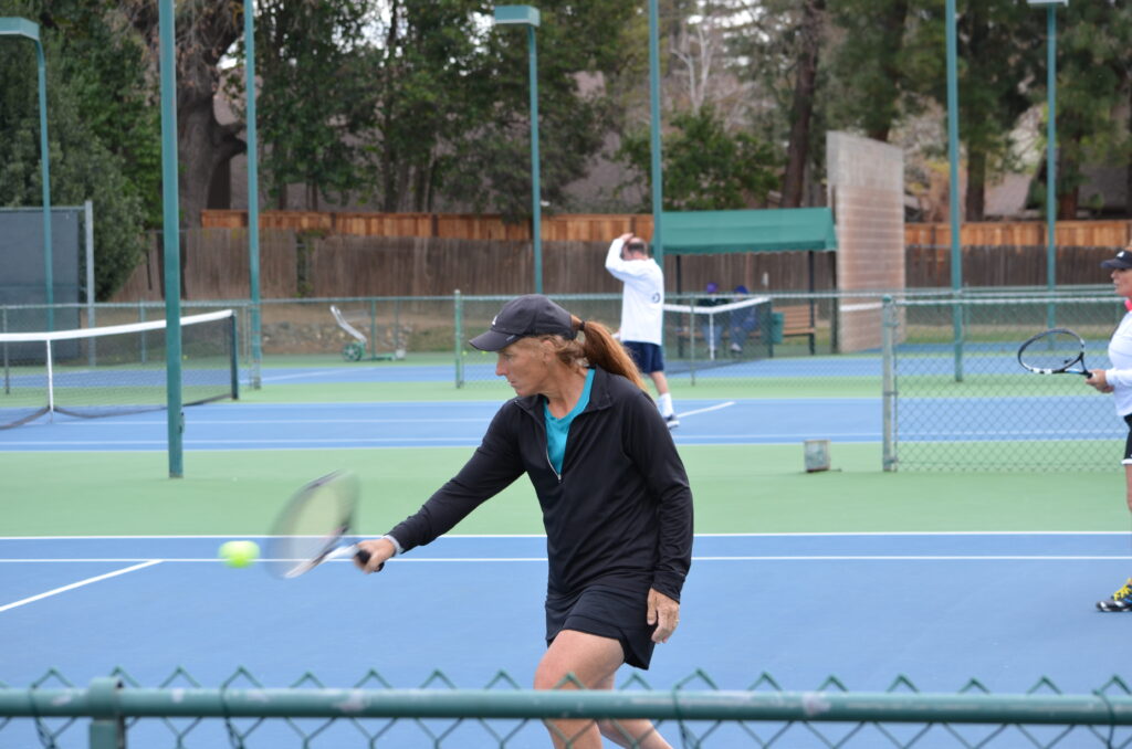 Heidi playing competitive tennis